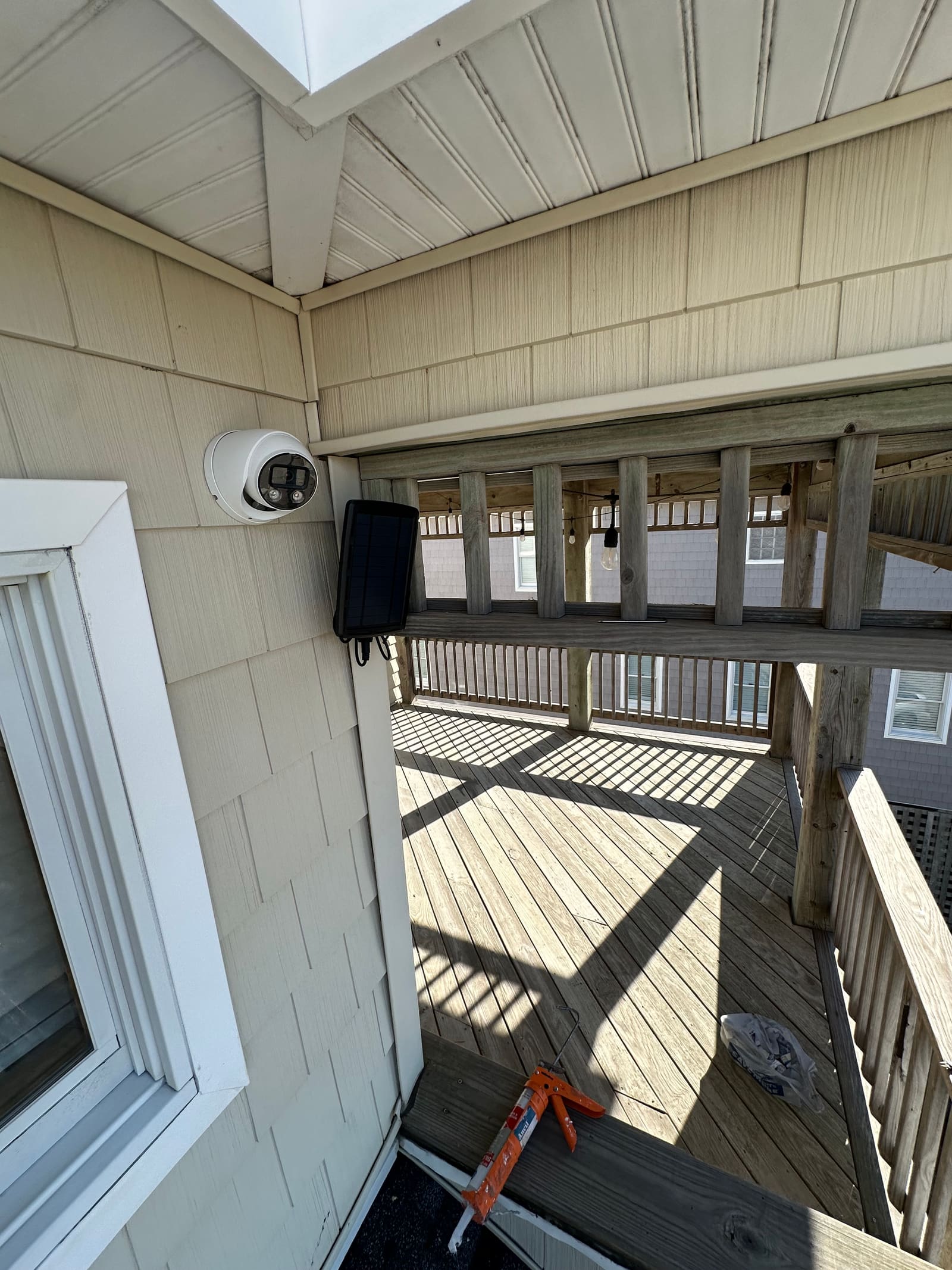 Security camera mounted on a beach house deck
