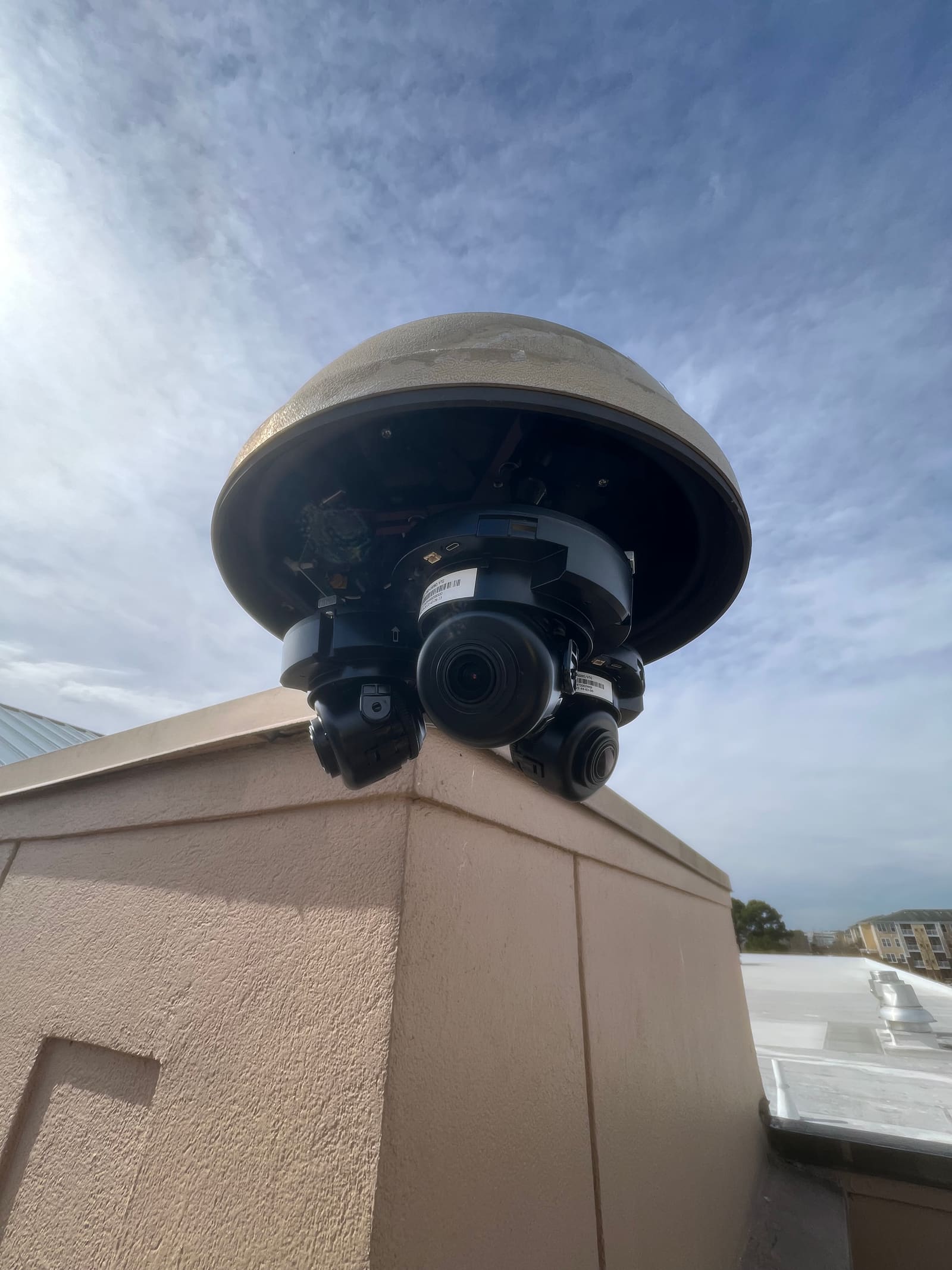 Multi-sensor security camera on a stone column