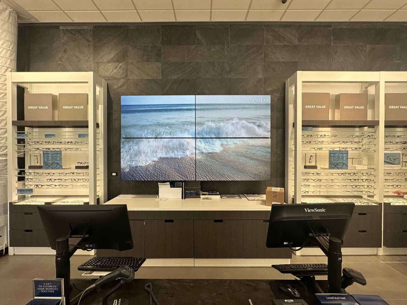Multi-screen video wall showing live camera feeds in a retail back office